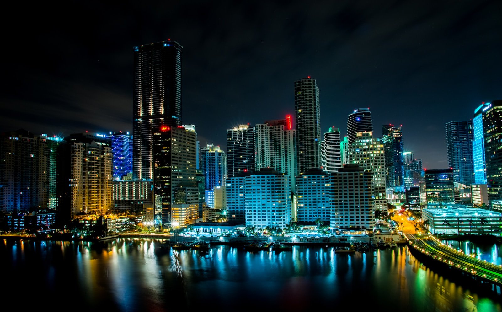 lighted building near body of water at nighttime